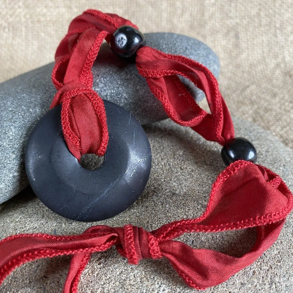 Shungite Donut Pendant on Red Silk