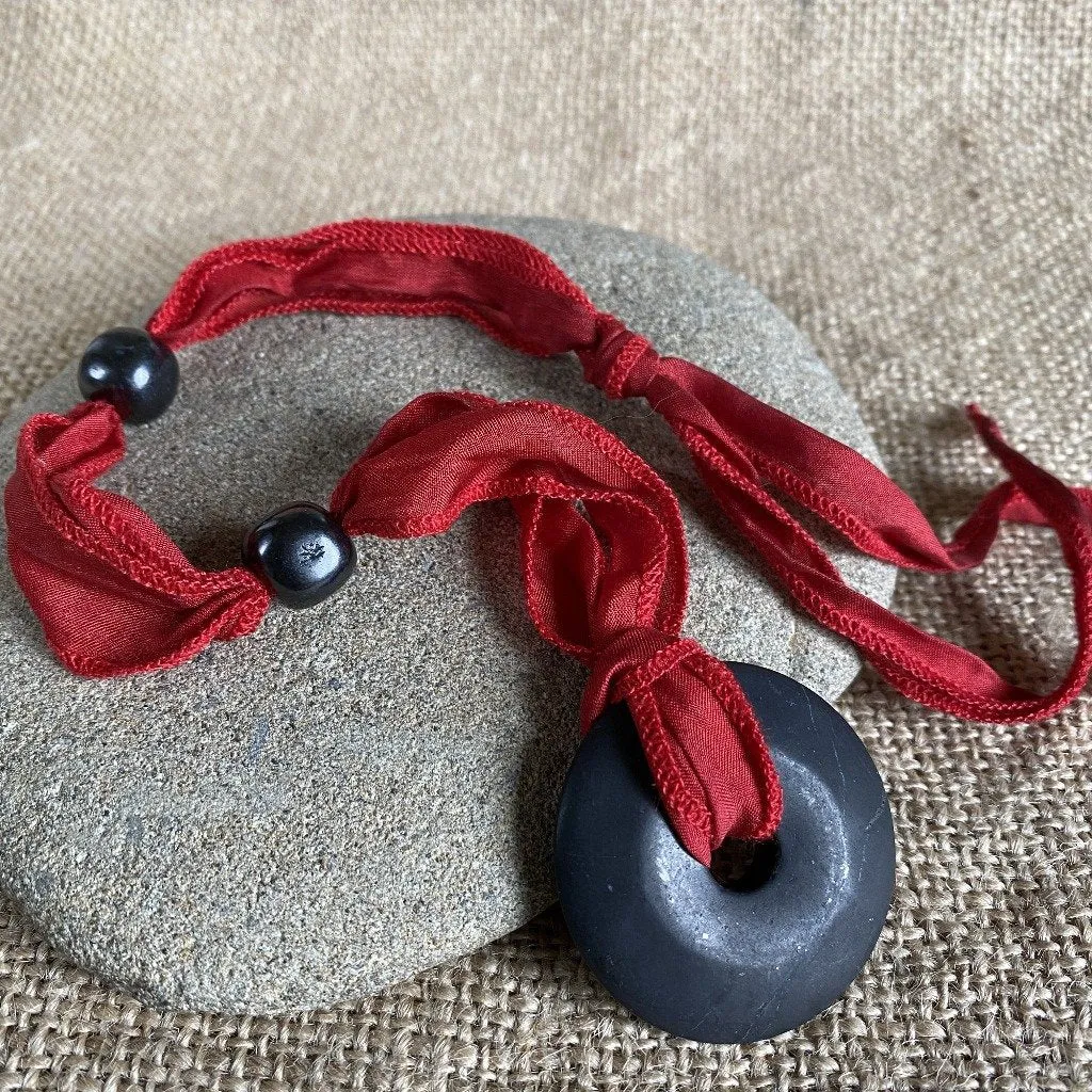 Shungite Donut Pendant on Red Silk